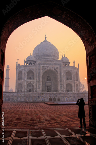 Taj Mahal at sunrise framed with the arch of the mosque, Agra, Uttar Pradesh, India