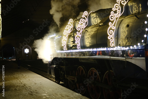 Christmas train with steam locomotive and illumination