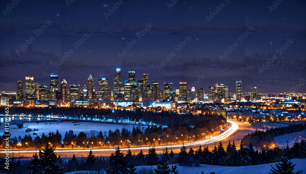 Naklejka premium Vue nocturne sur la ville illuminée en hiver