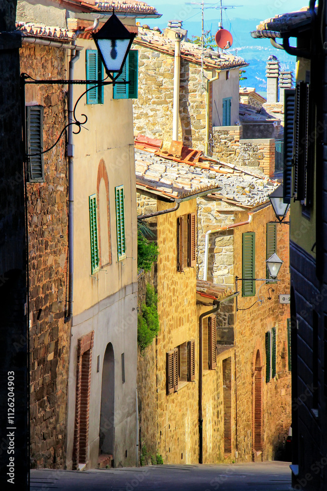 Fototapeta premium Narrow street in historic center of Montalcino town, Val d'Orcia, Tuscany, Italy