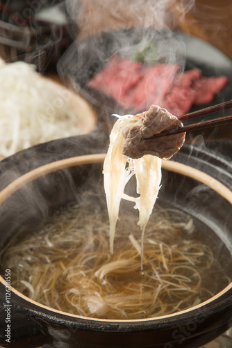 Shabu-shabu meat wrapped with white onion photo