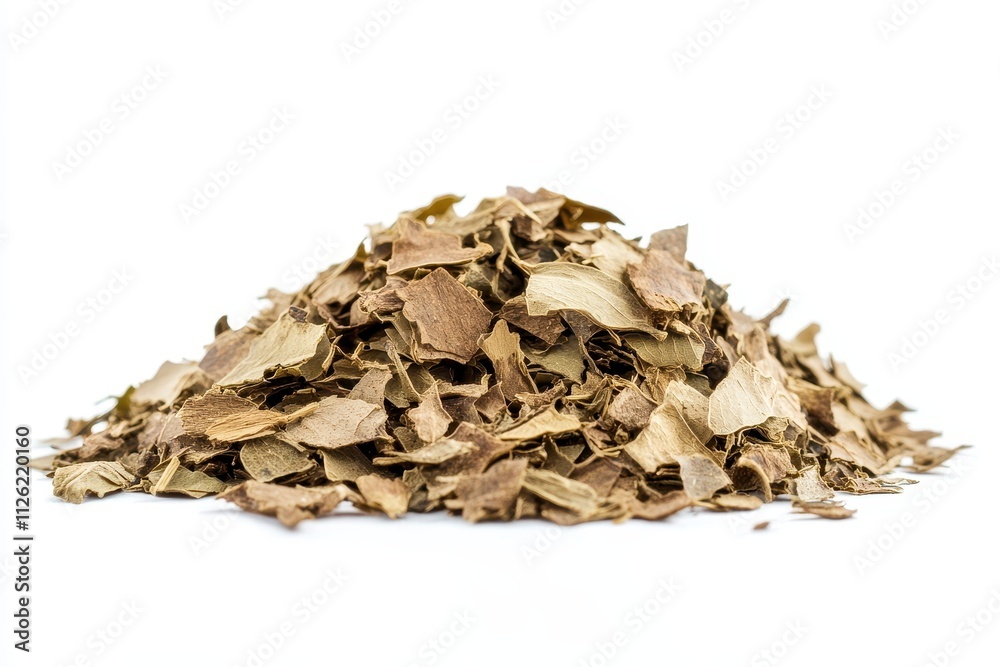 Dried herb leaves piled on a white surface, showcasing natural texture and color variations Dried herb leaves piled on a white surface, showcasing natural texture and color variations
