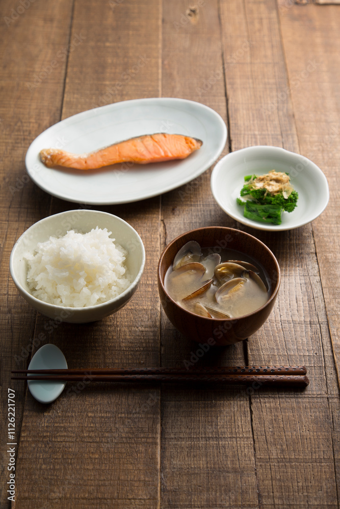 Breakfast of white rice, miso soup with Asari Clam, rape blossoms and grilled salmon Breakfast of white rice, miso soup with Asari Clam, rape blossoms and grilled salmon