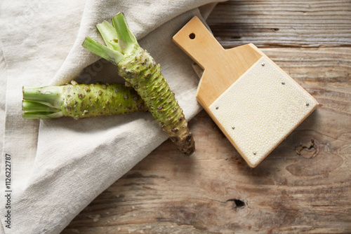 Samegawa grater and wasabi on a wooden table photo