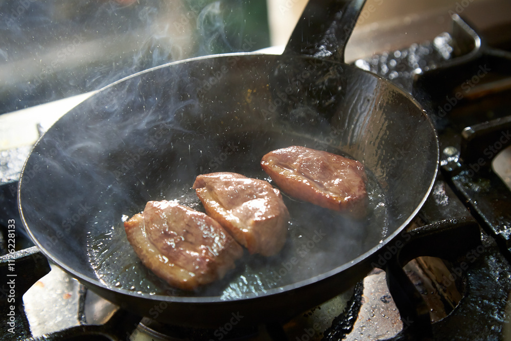 Photo of the process of roasting duck for Kamo Seiro Soba. Photo of the process of roasting duck for Kamo Seiro Soba.