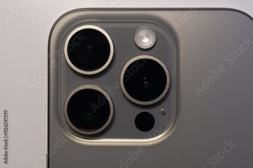 A detailed series showcasing various aspects of a smartphone. The images focus on the bottom edge, highlighting the charging port and speaker grills, and the rear camera module photo