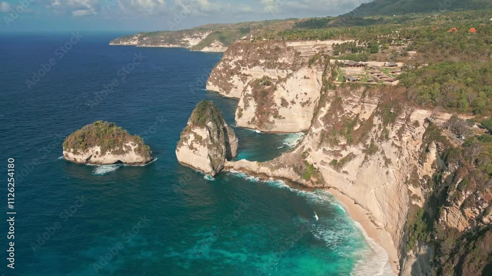 Towering Limestones Cliffs Of Diamond Beach On Nusa Penida Island, Bali Indonesia. Aerial Drone Shot Towering Limestones Cliffs Of Diamond Beach On Nusa Penida Island, Bali Indonesia. Aerial Drone Shot
