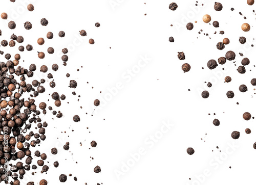 Close up of black and brown peppercorns on black background