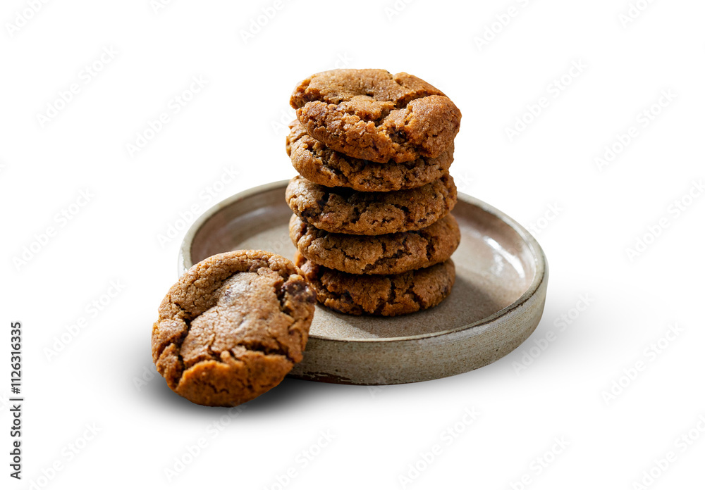 A stack of freshly baked chocolate chip cookies on a rustic ceramic plate, showcasing their golden-brown, chewy texture. One cookie lies invitingly at the base, adding a touch of charm. A stack of freshly baked chocolate chip cookies on a rustic ceramic plate, showcasing their golden-brown, chewy texture. One cookie lies invitingly at the base, adding a touch of charm.
