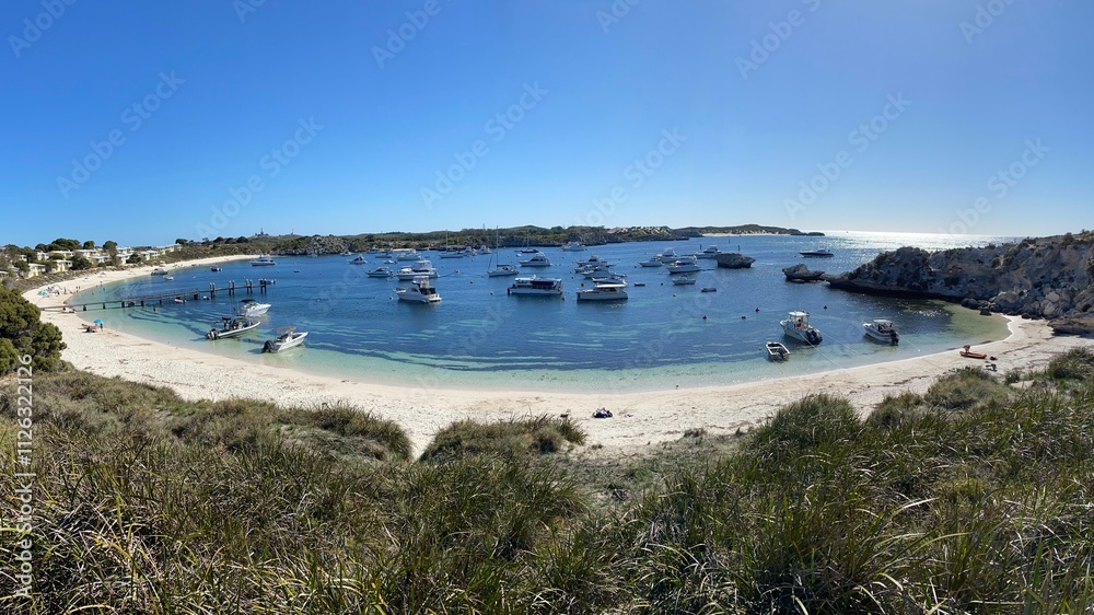 Panoramic Bliss: Swimmers and Scenic Bay at Rottnest Island Panoramic Bliss: Swimmers and Scenic Bay at Rottnest Island