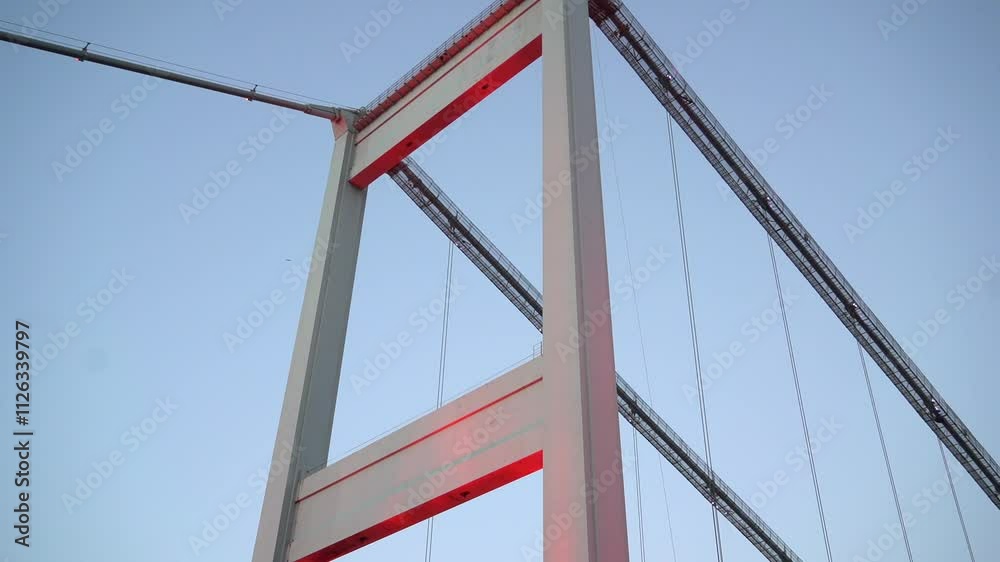 Close-up of a suspension bridge tower and cables Close-up of a suspension bridge tower and cables