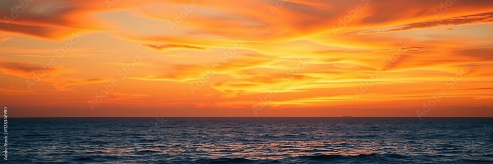 Vibrant orange hues with gentle wisps of cloud, softly fading into the serene blue ocean at dusk, calmness, color Vibrant orange hues with gentle wisps of cloud, softly fading into the serene blue ocean at dusk, calmness, color