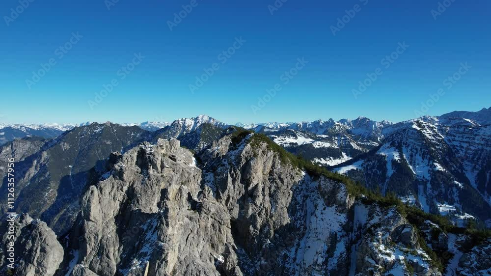 Time lapse aerial shot around the mountain Alpsitz in Liechtenstein next to Switzerland and Austria. Perfect weather consition with a stunning view over the alps. Time lapse aerial shot around the mountain Alpsitz in Liechtenstein next to Switzerland and Austria. Perfect weather consition with a stunning view over the alps.