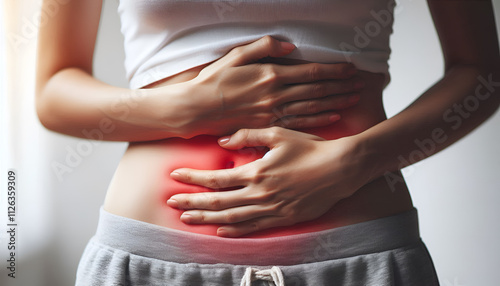 A young woman suffering from abdominal pain.