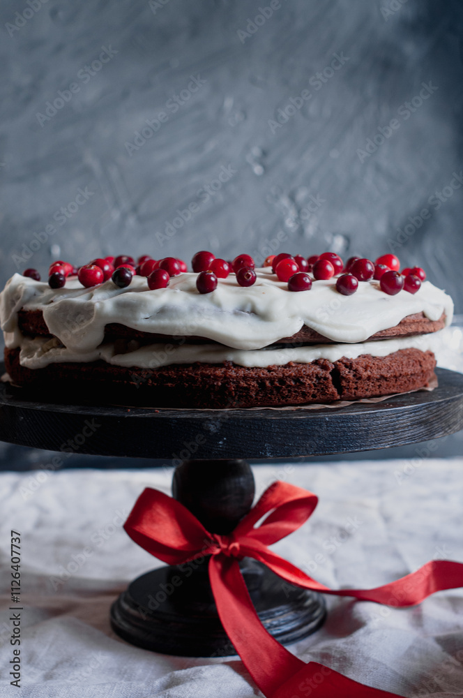 Delicious ready to eat wreath Christmas cake decorated with fresh cranberries and cream cheese frosting with festive styling Delicious ready to eat wreath Christmas cake decorated with fresh cranberries and cream cheese frosting with festive styling