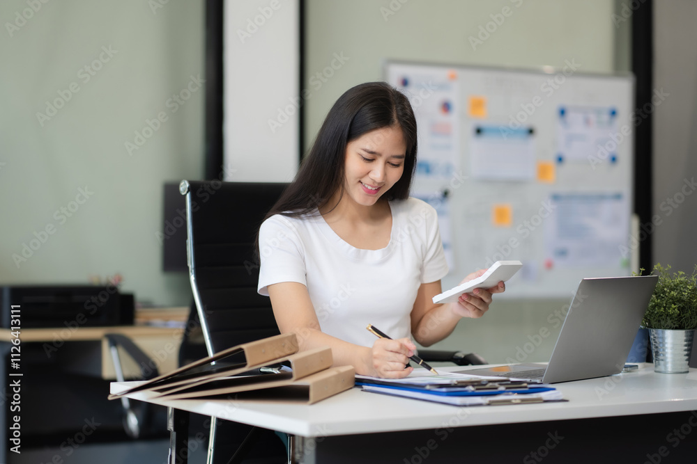 Business woman are calculating income-expenditure and analyzing real estate investment data at office, Accounting Financial and tax systems concept. Business woman are calculating income-expenditure and analyzing real estate investment data at office, Accounting Financial and tax systems concept.