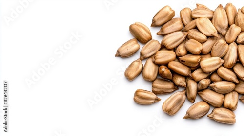 A photostock of scattered sunflower seeds on a clean white background, emphasizing snack and healthy food concepts. High Quality