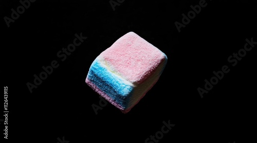 multicolored marshmallow cube on black background viewed from above showcasing vibrant colors and soft texture for culinary or dessert themes