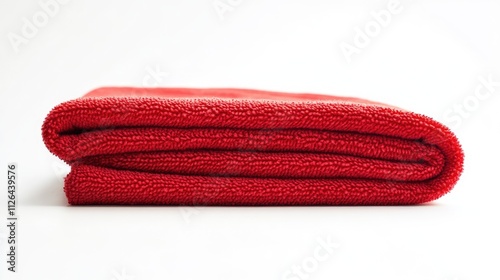 Folded red microfiber duster on white background ideal for cleaning and household use in professional studio photography setup