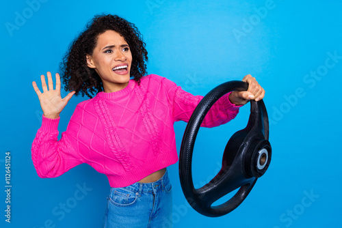 Photo of angry furous lady dressed knitted pullover driving auto honking empty space isolated blue color background photo