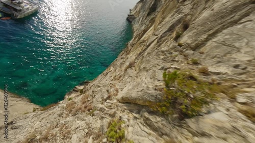 FPV shot of a mountain goat climbing a cliff on a Greek island photo