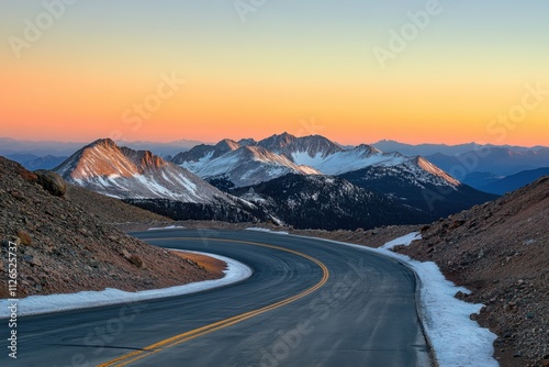 Majestic mountain pass journey at sunset scenic road snowcapped peaks high-altitude adventure serene landscape views nature's beauty unveiled in the mountains