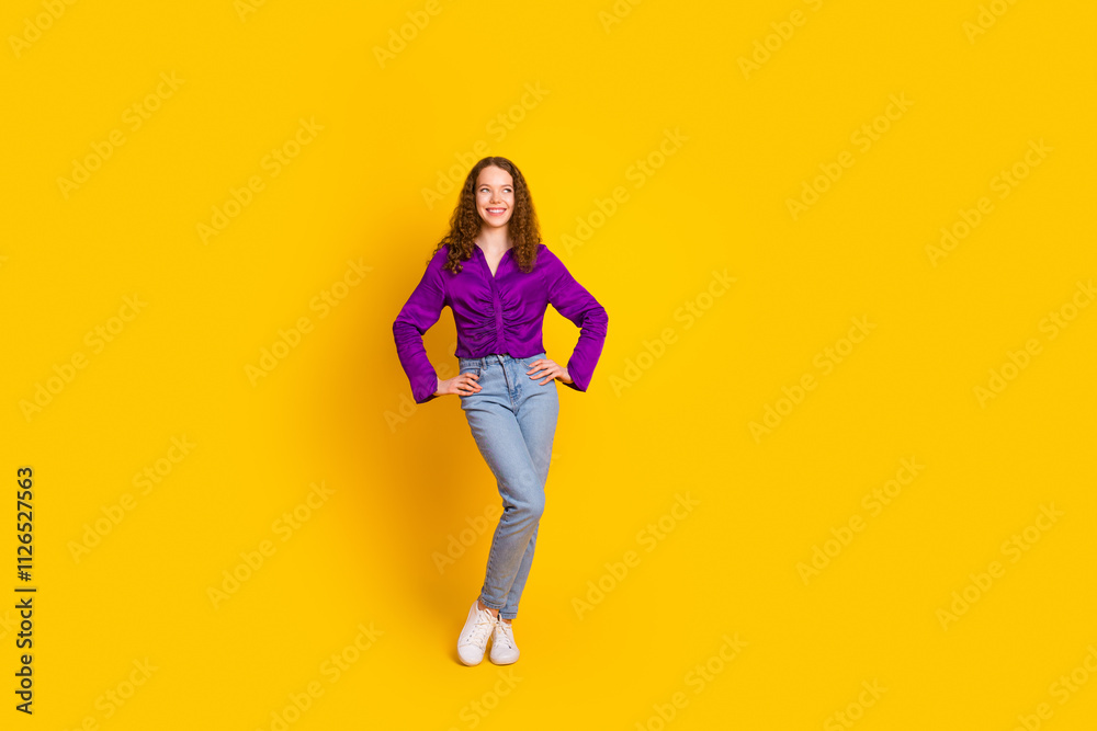 Full size photo of attractive young woman posing model dressed stylish violet clothes isolated on yellow color background Full size photo of attractive young woman posing model dressed stylish violet clothes isolated on yellow color background