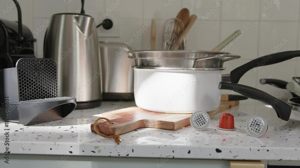 Kitchen cooking utensils and appliances on countertop