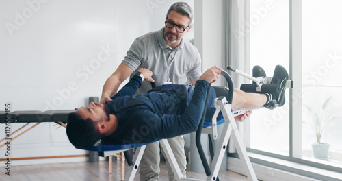 Physiotherapy, consulting and inversion table with man in clinic for back pain, spine decompression and core strength. Rehabilitation, health and advice with people for chiropractor, help and healing