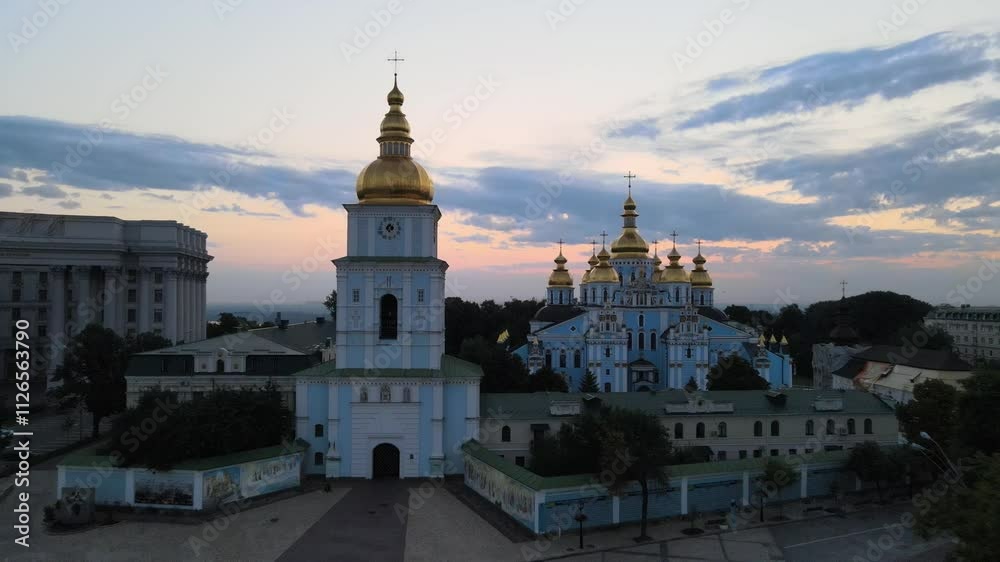 St Michael's Golden-Domed Monastery with a river behind it at sunset time in Kyiv, Ukraine