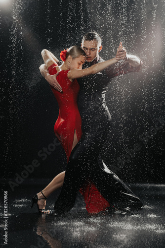 A couple of dancers on a black background in a studio in the aqua zone