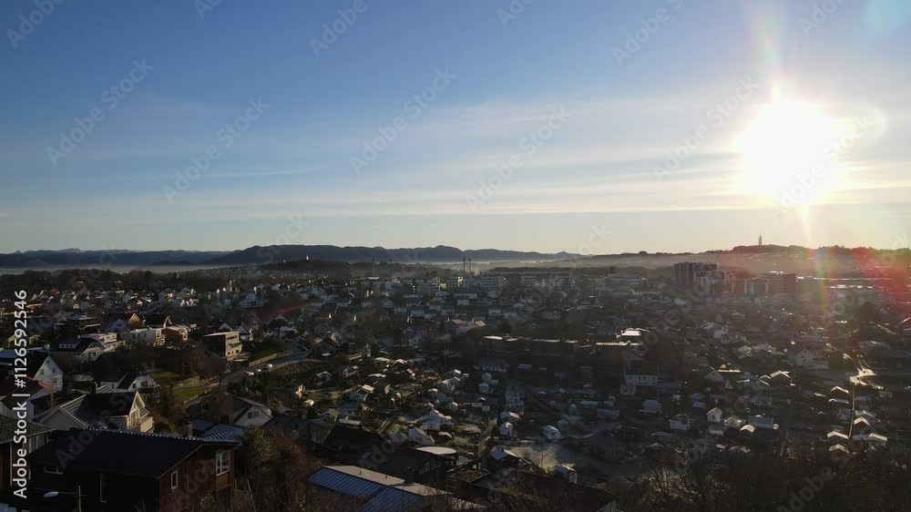 Aerial Drone Shot Over a Suburban Area with a Mountain Backdrop in Winter Aerial Drone Shot Over a Suburban Area with a Mountain Backdrop in Winter