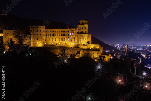 An Ancient Castle Illuminating the Night with Its Historic Details photo