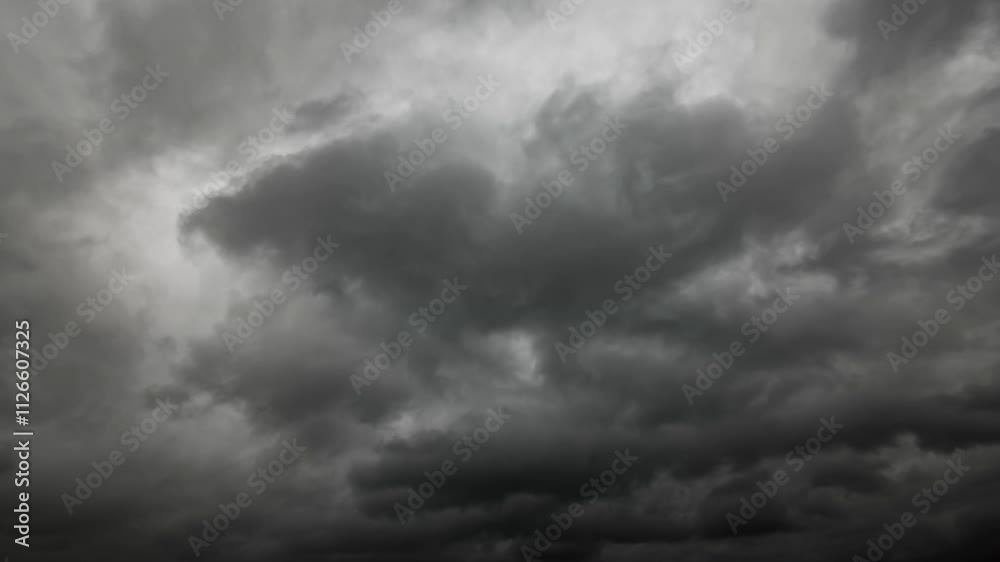 timelapse of dark dramatic sky with black stormy clouds before rain as abstract background, extreme weather

