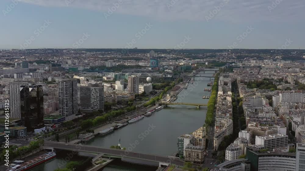 PARIS, FRANCE - OCTOBER 3, 2024: Stunning aerial view of the Seine River with city skyline and bridges in the heart of Paris