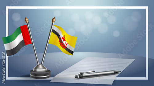 United Arab Emirate and Brunei National flags on small table with bokeh background, cooperative relationship