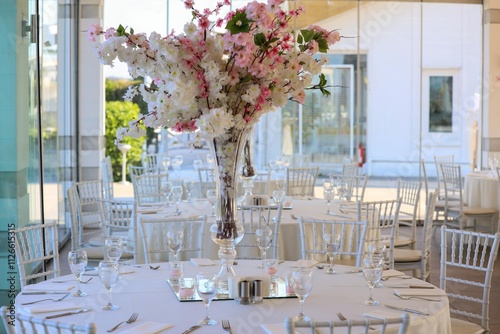 Obraz na płótnie Elegant Outdoor Wedding Reception with Long Tables, White Decor, and Colorful Floral Runner w salonie