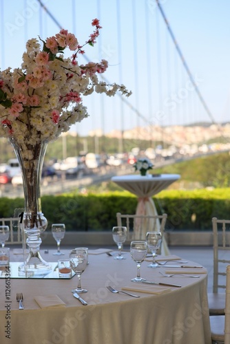 Obraz na płótnie Elegant Outdoor Wedding Reception with Long Tables, White Decor, and Colorful Floral Runner w salonie