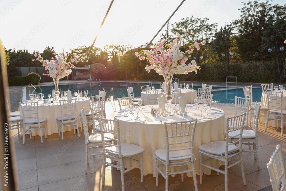 Luxury Wedding Dinner Setting with Vibrant Flowers and Candles in a Historic Stone Venue
