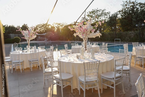 Obraz na płótnie Luxury Wedding Dinner Setting with Vibrant Flowers and Candles in a Historic Stone Venue w salonie