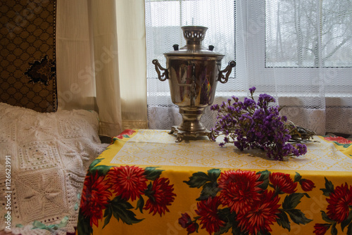 Canvas Print samovar on the table in the village