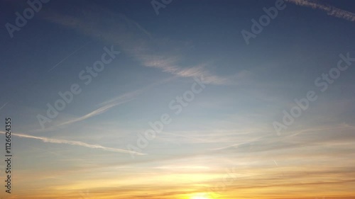 Sunset with contrails with blue sky