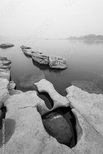 Pothole landforms on the Yangtze River. Located in Qilin Square, Luzhou City, Sichuan Province. Black and white photo. photo