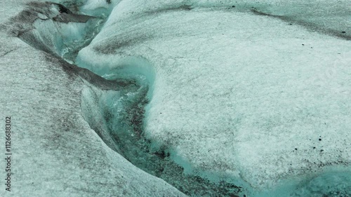 A ravishing river of pure glacier water flows down the glacier