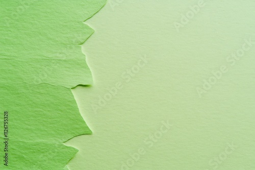 Minimalist Torn Green Paper Texture on Monotone Background photo