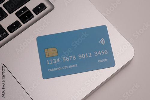 Close up of debit and credit cards placed in front of laptop. online shopping payment and retail concept. mockups and fake credit cards. Color credit card.