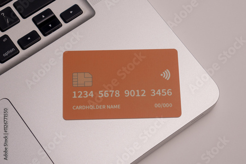 Close up of debit and credit cards placed in front of laptop. online shopping payment and retail concept. mockups and fake credit cards. Color credit card.