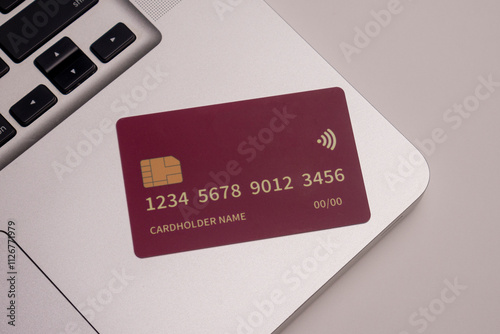 Close up of debit and credit cards placed in front of laptop. online shopping payment and retail concept. mockups and fake credit cards. Color credit card.