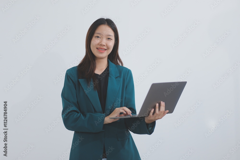 Attractive elegant young asian business woman using digital tablet standing on isolated background. Happy young latin female formal black suit holding tablet gadget working service with customer Attractive elegant young asian business woman using digital tablet standing on isolated background. Happy young latin female formal black suit holding tablet gadget working service with customer