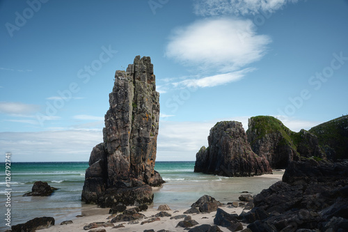 Fototapeta Naklejka Na Ścianę i Meble -  A high cliff in a rocky sea cove in the north of the Isle of Lewis. Garry Beach, Isle of Lewis, Scotland, UK